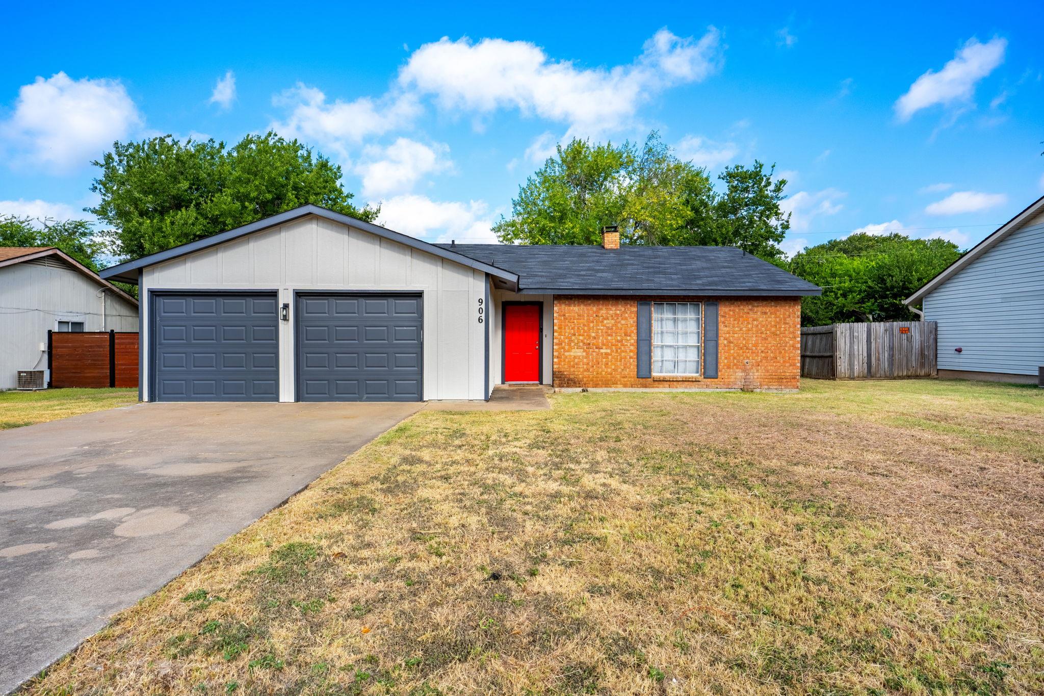 Classic brick and siding accents define the exter