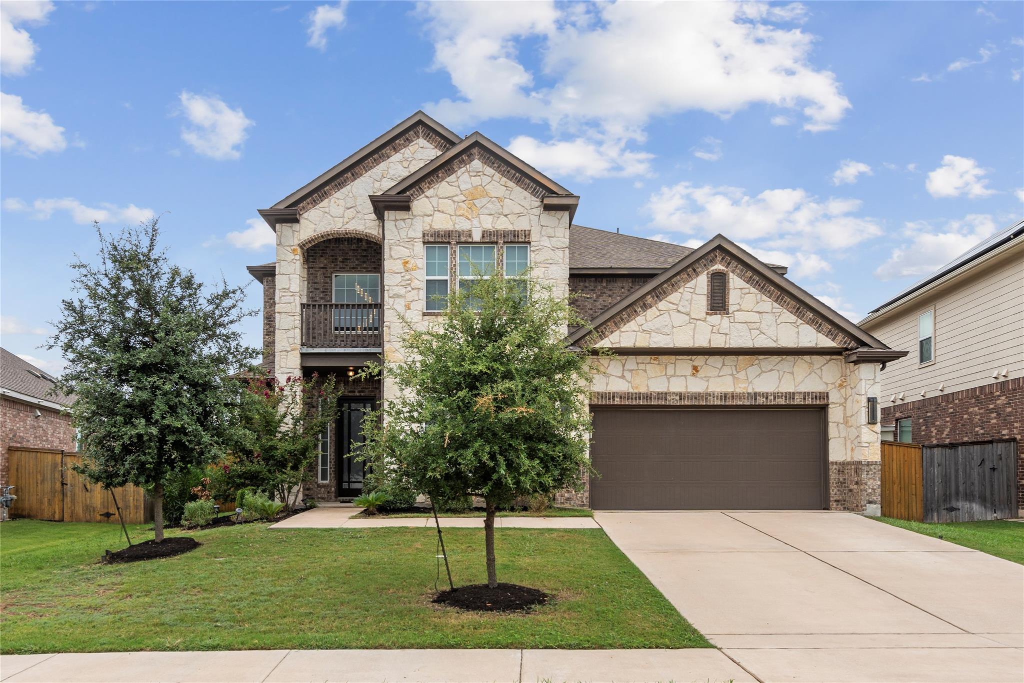 Striking stone and brick accents define this mult