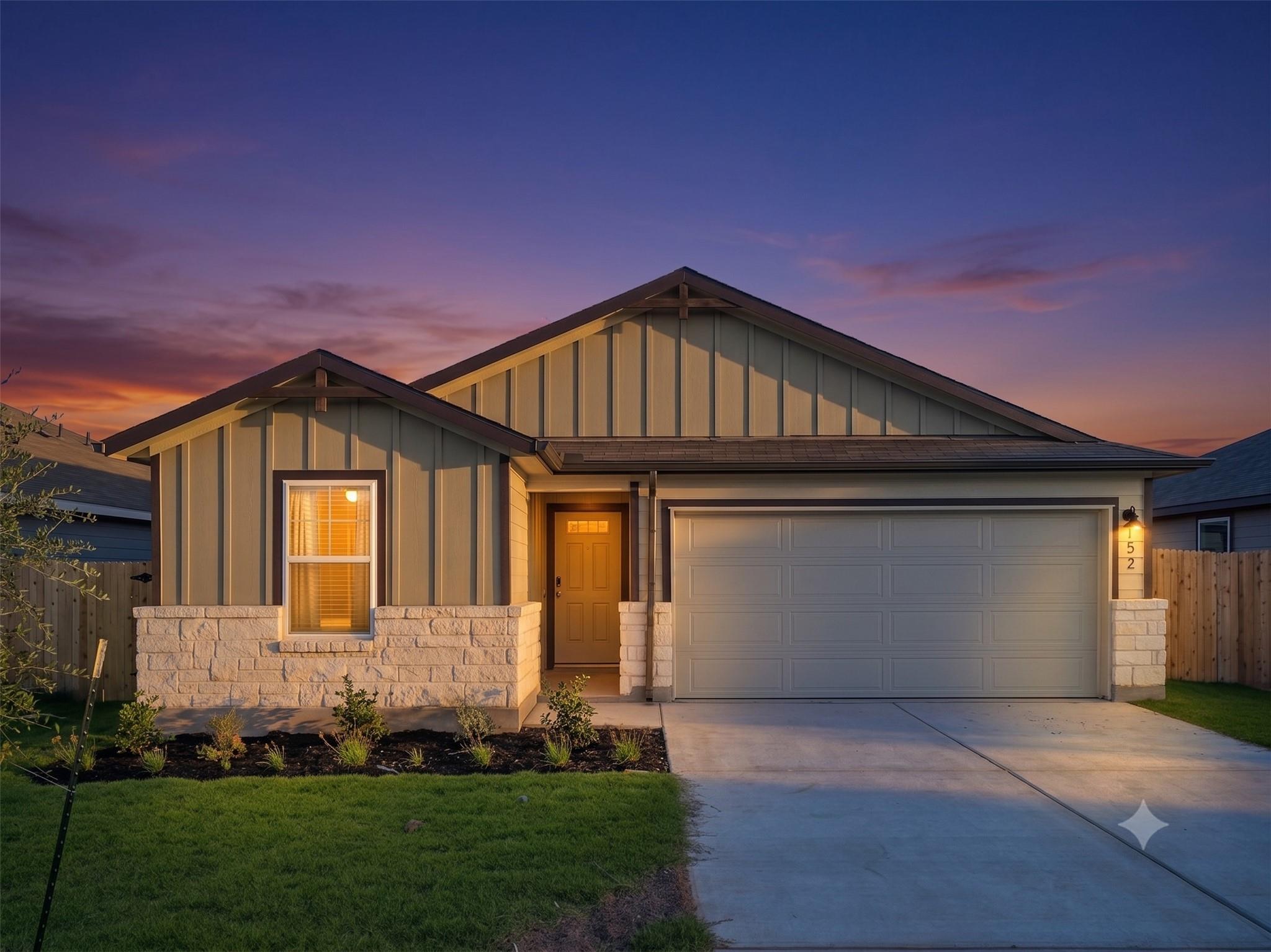 Board and batten siding pairs with stone accents 