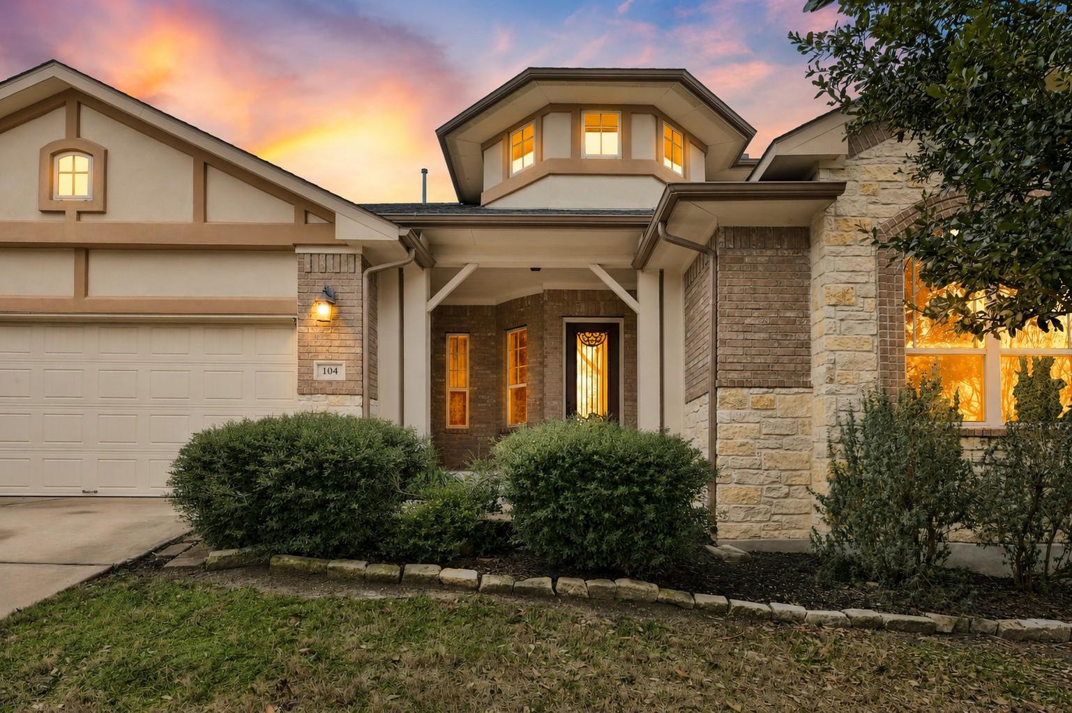 Stone and stucco accents define the multi-texture