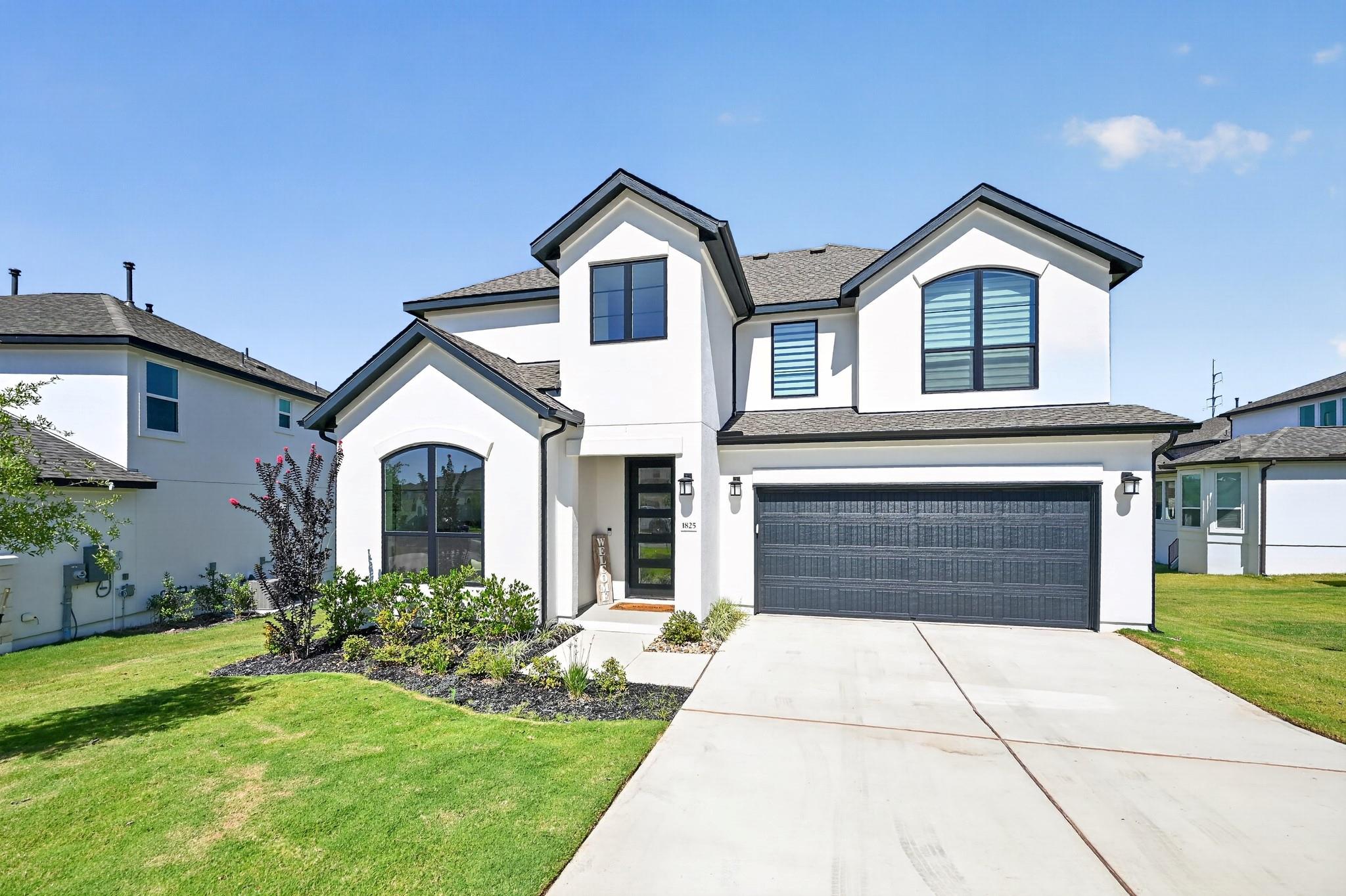 Crisp white stucco contrasts with dark trim on th