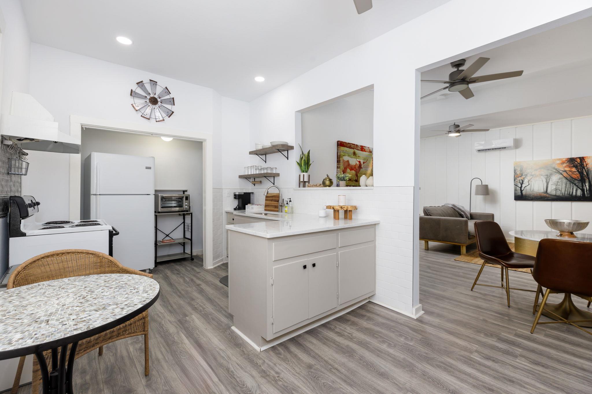 An open kitchen layout flows seamlessly into adja