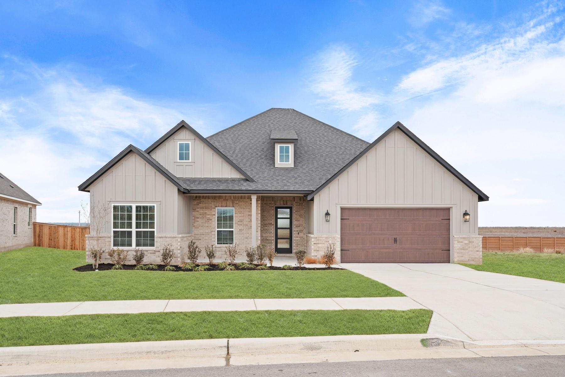 A classic brick and siding exterior stands out ag