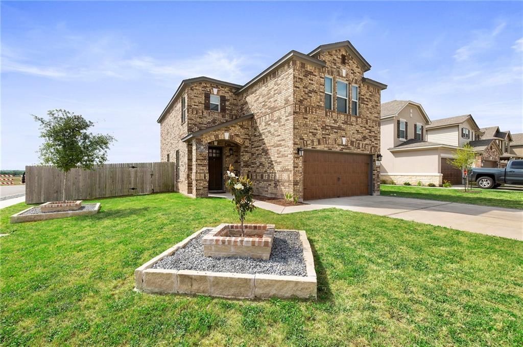 An attractive two-story brick exterior showcases 
