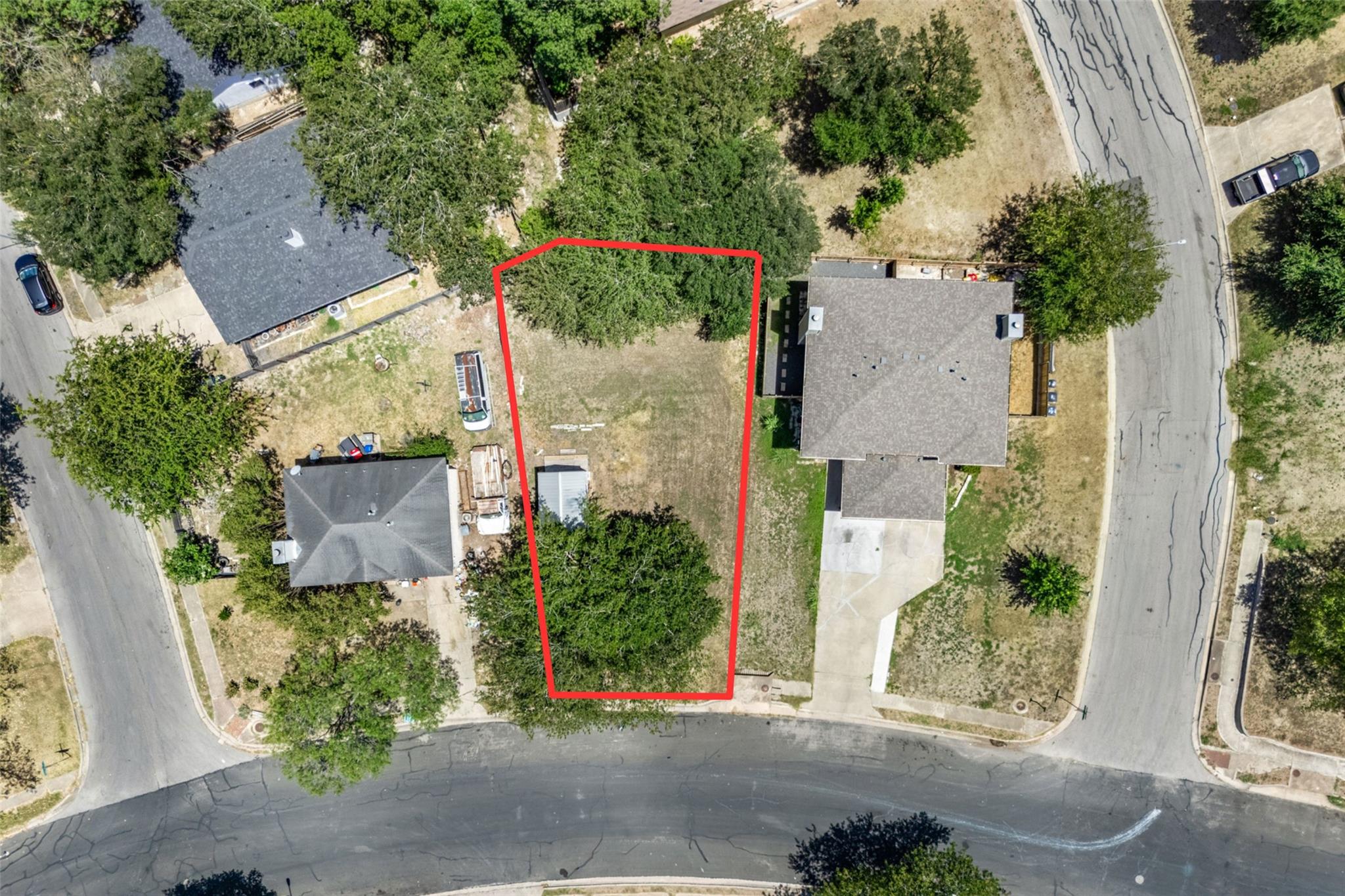 Mature trees frame this residential lot nestled w