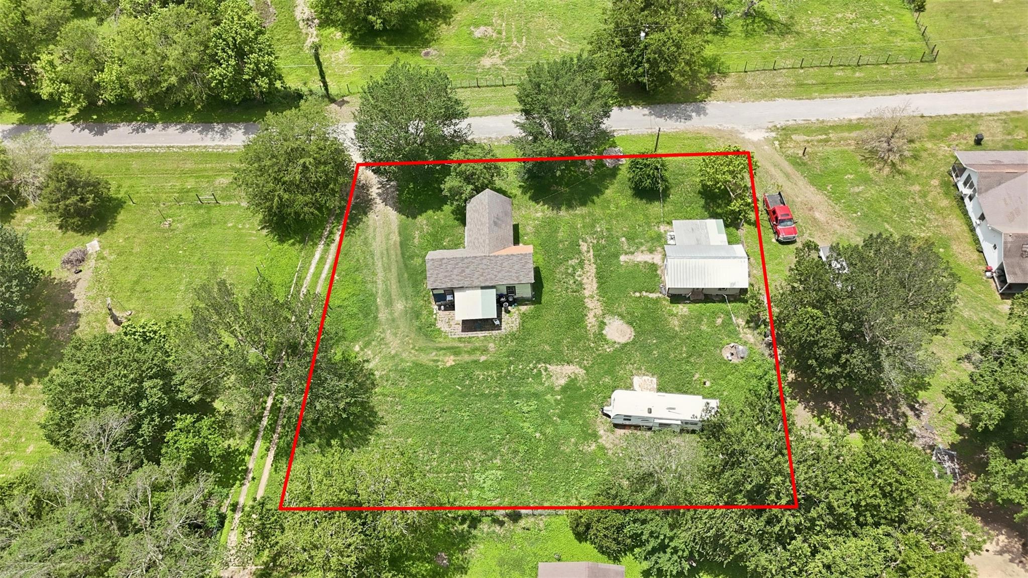 Mature trees surround this sizable property with 