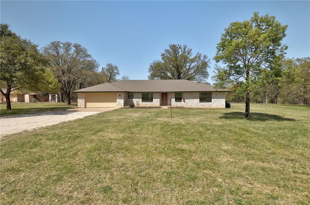 A classic stone exterior defines this ranch home 