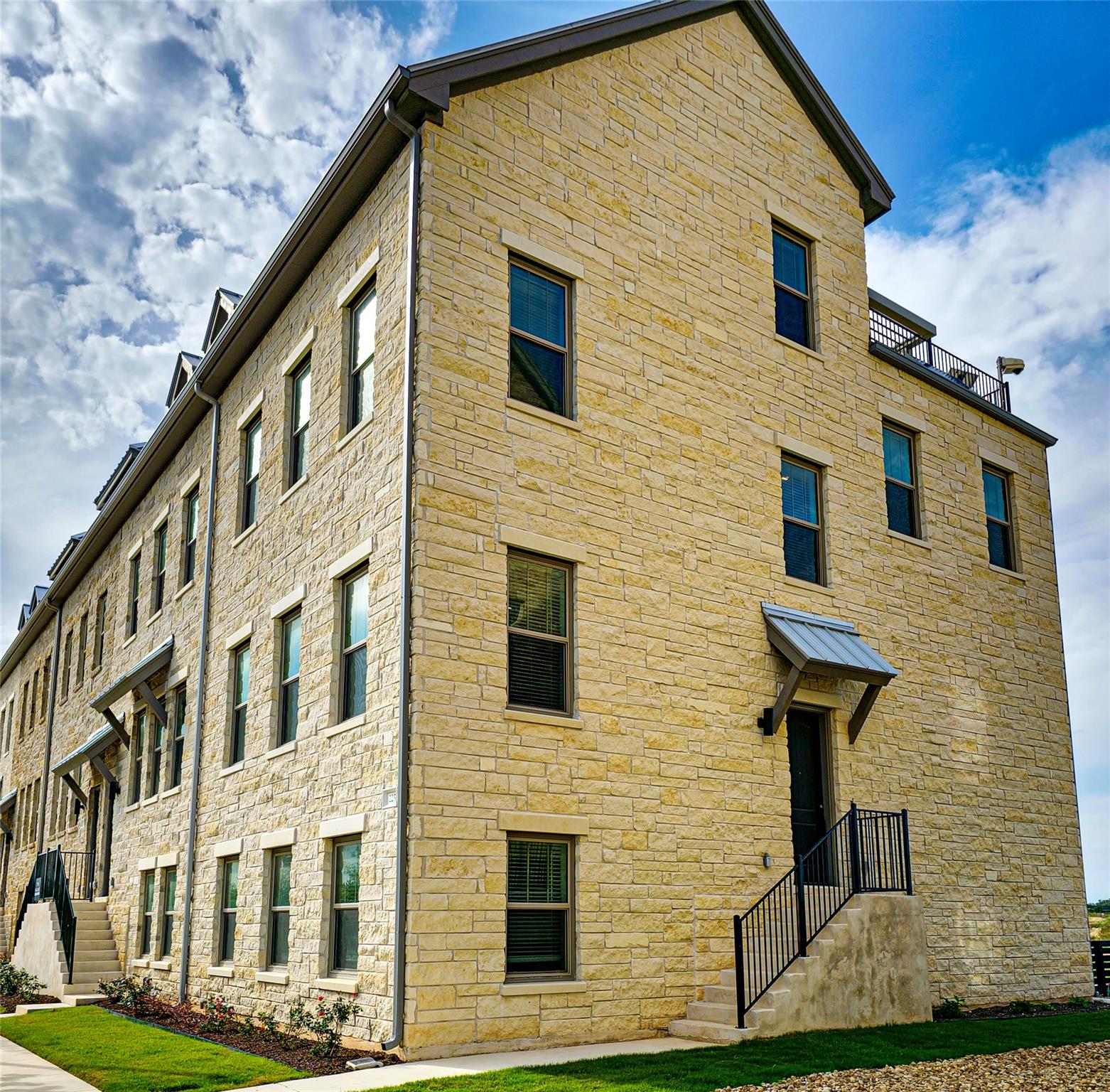Striking stone facades rise under open skies, pre