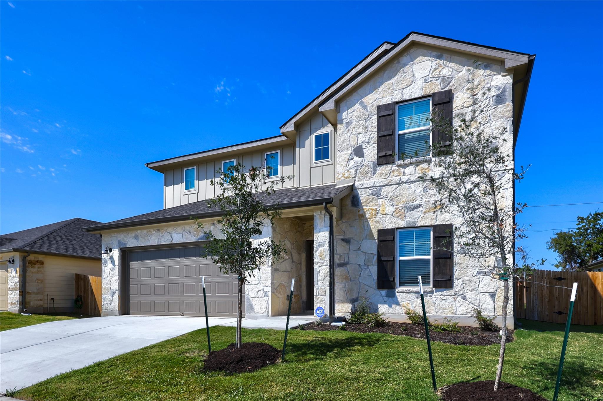 Natural stone masonry and classic shutters create