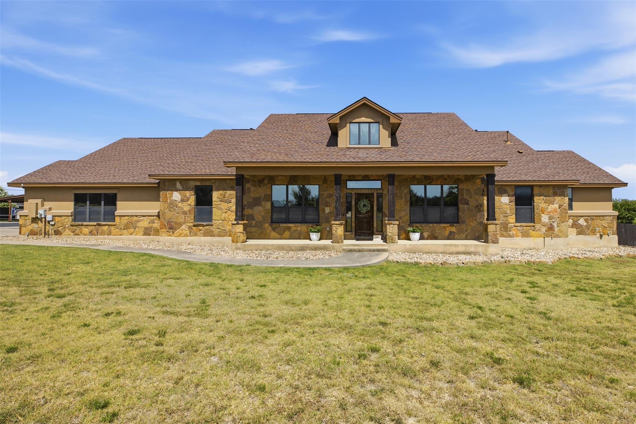A striking stone exterior and prominent gables de