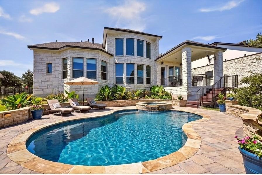 An inviting stone exterior frames this private ba