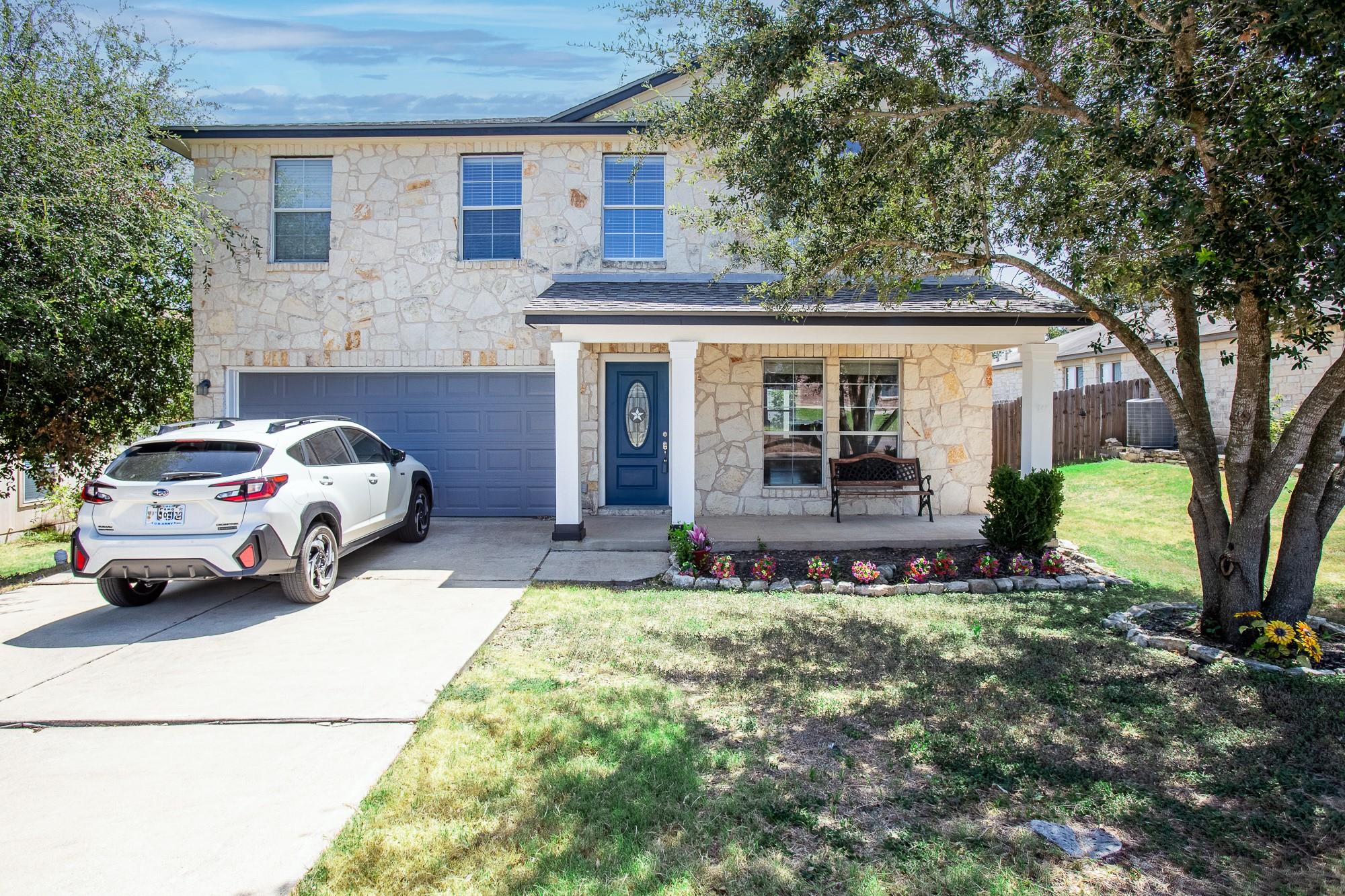 Natural stone masonry and a welcoming front porch