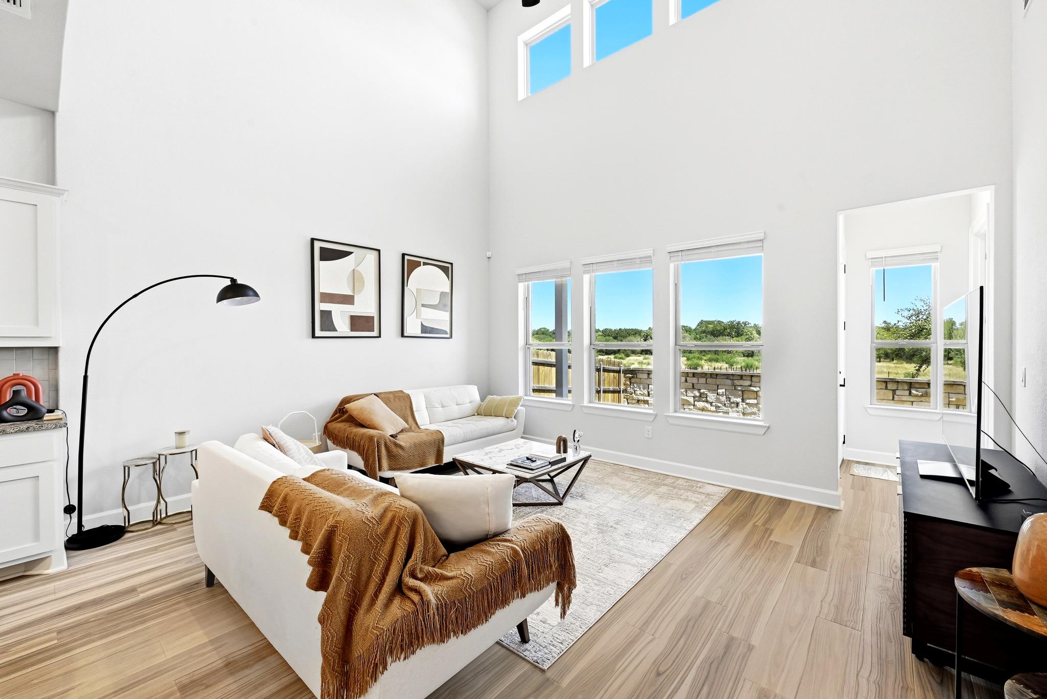 Double-height ceilings and tall windows frame pea