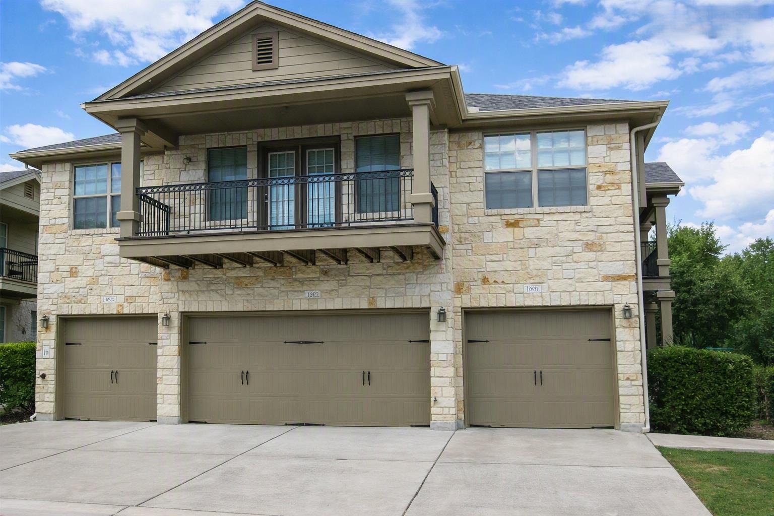 Stone and siding exterior showcases a private bal