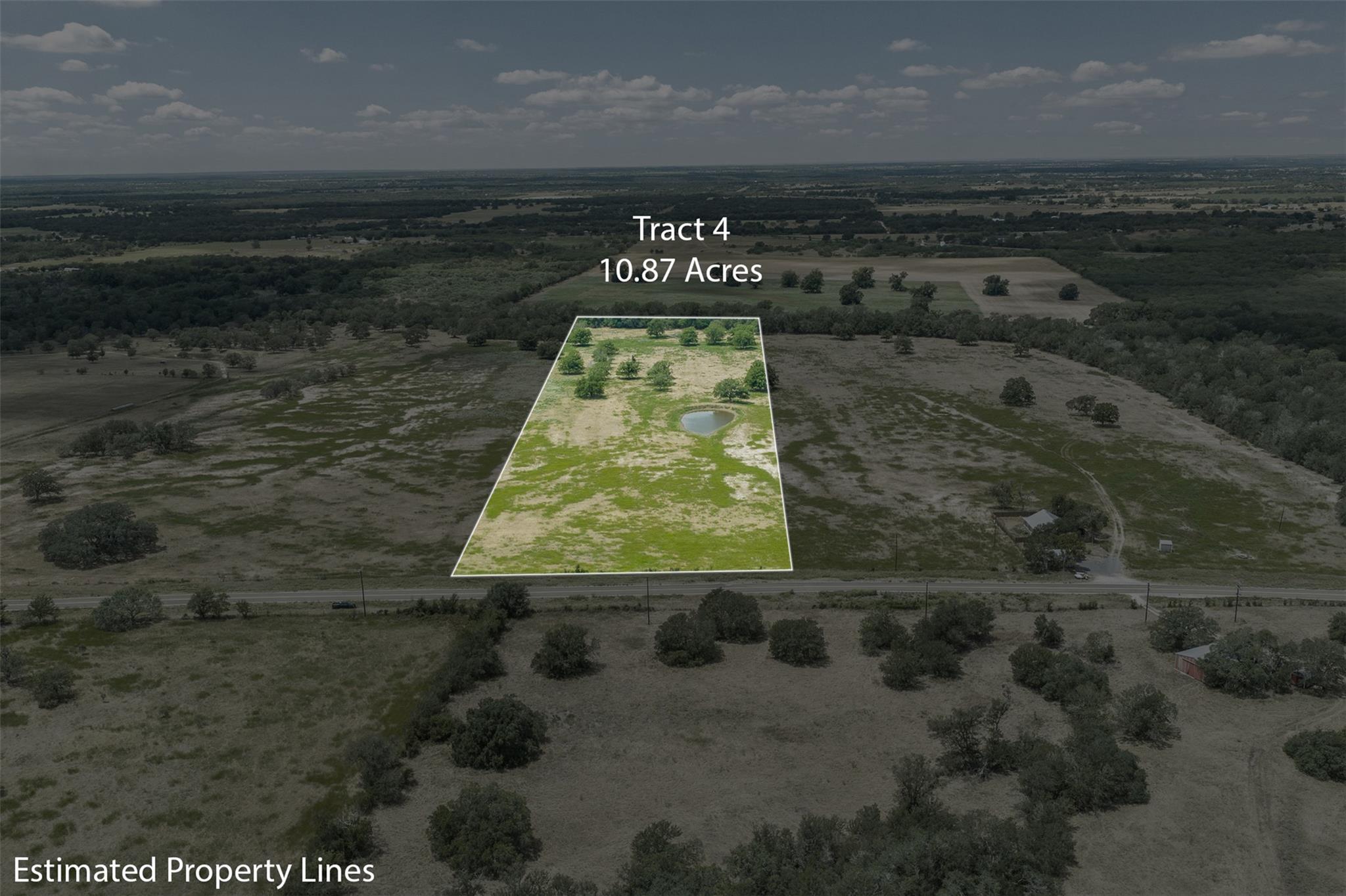 A spacious tract of land features a private pond 