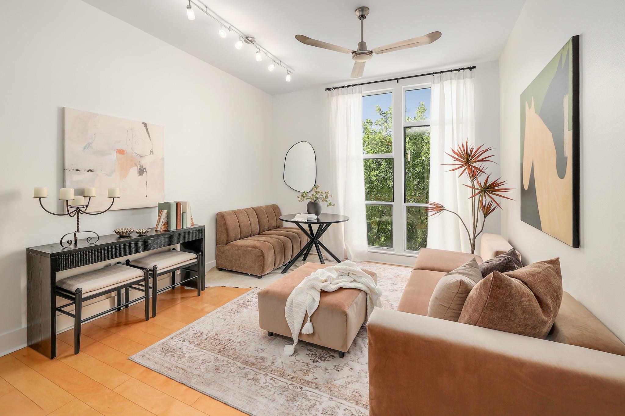 High ceilings and hardwood floors define this inv
