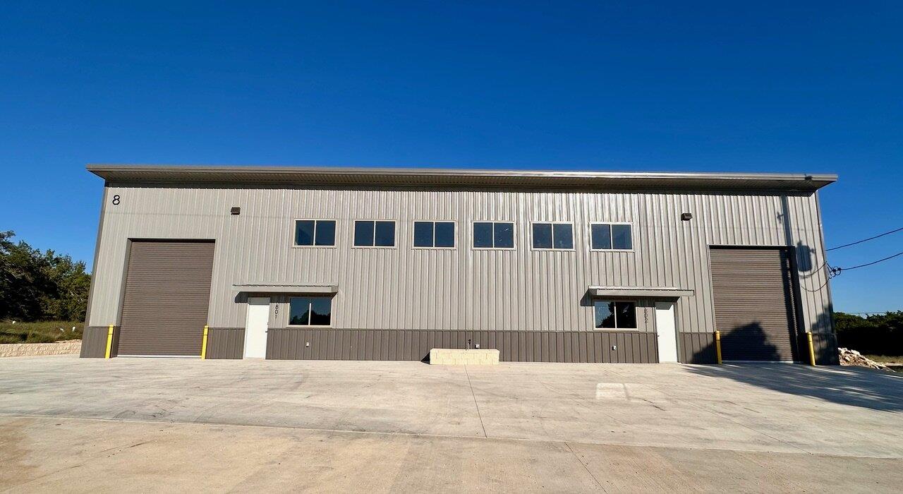 Industrial metal building features dual roll-up d