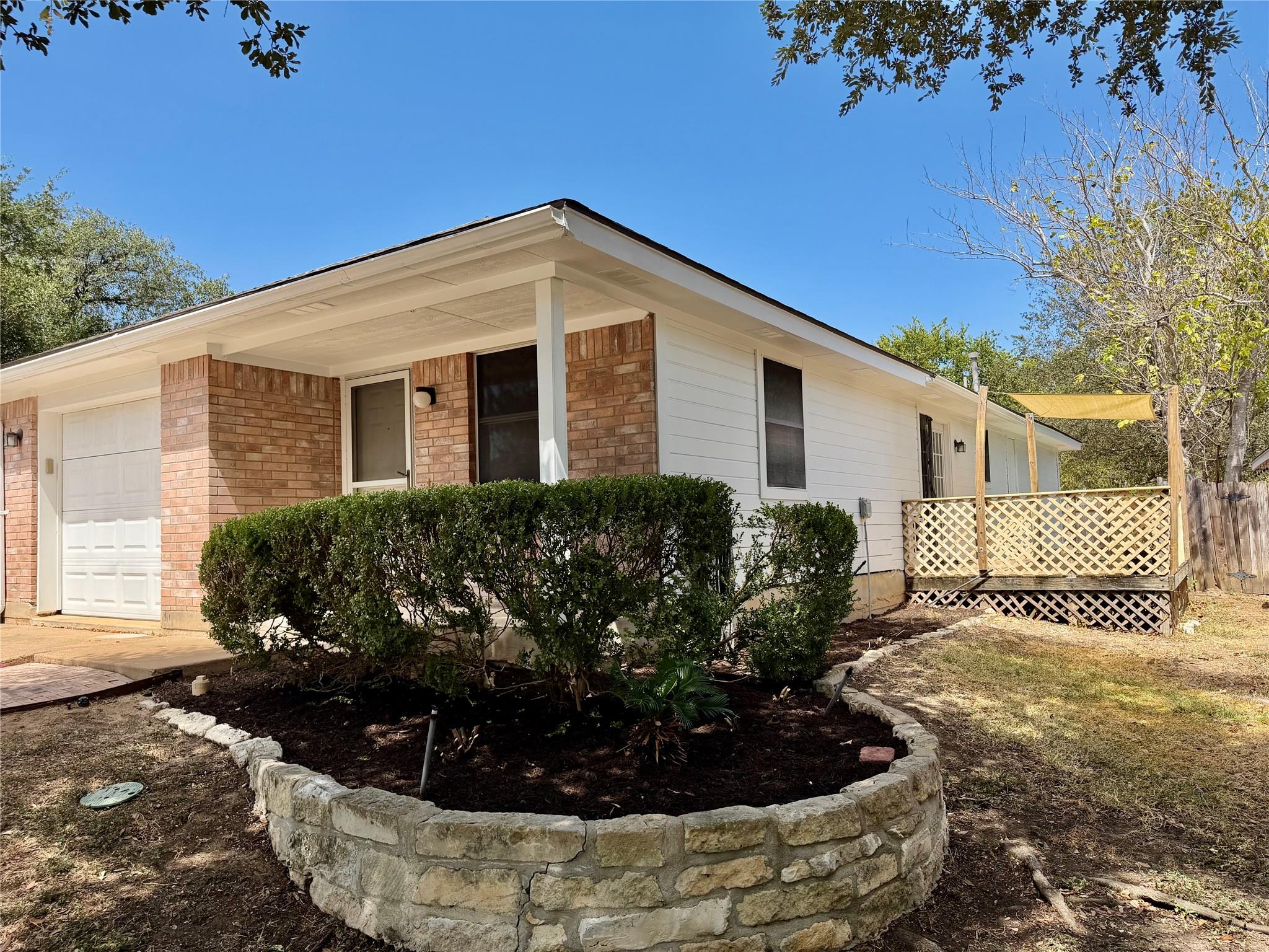 Brick accents and a classic front porch create we