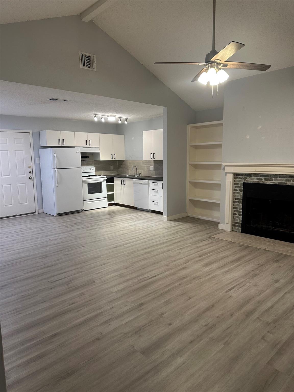 An open floorplan seamlessly connects the living 