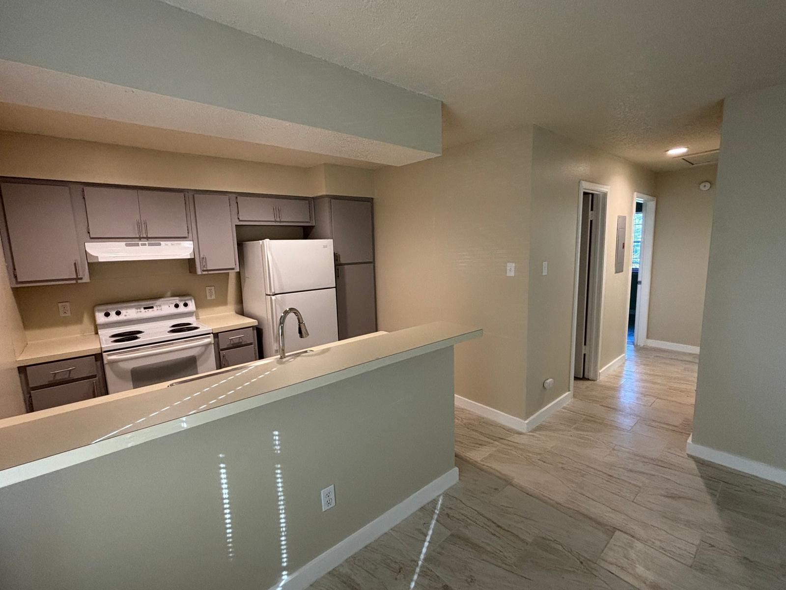 An open layout connects the kitchen and breakfast