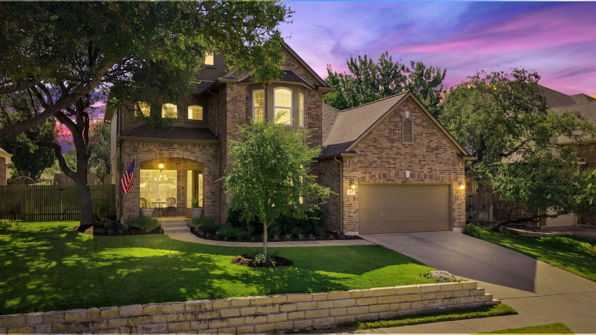 Stately brick exterior showcasing a multi-car gar