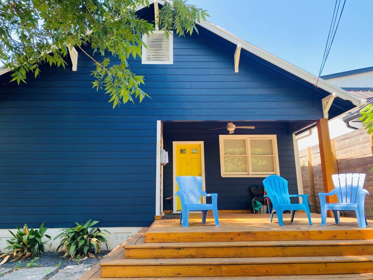 A spacious wooden deck extends from the back of t