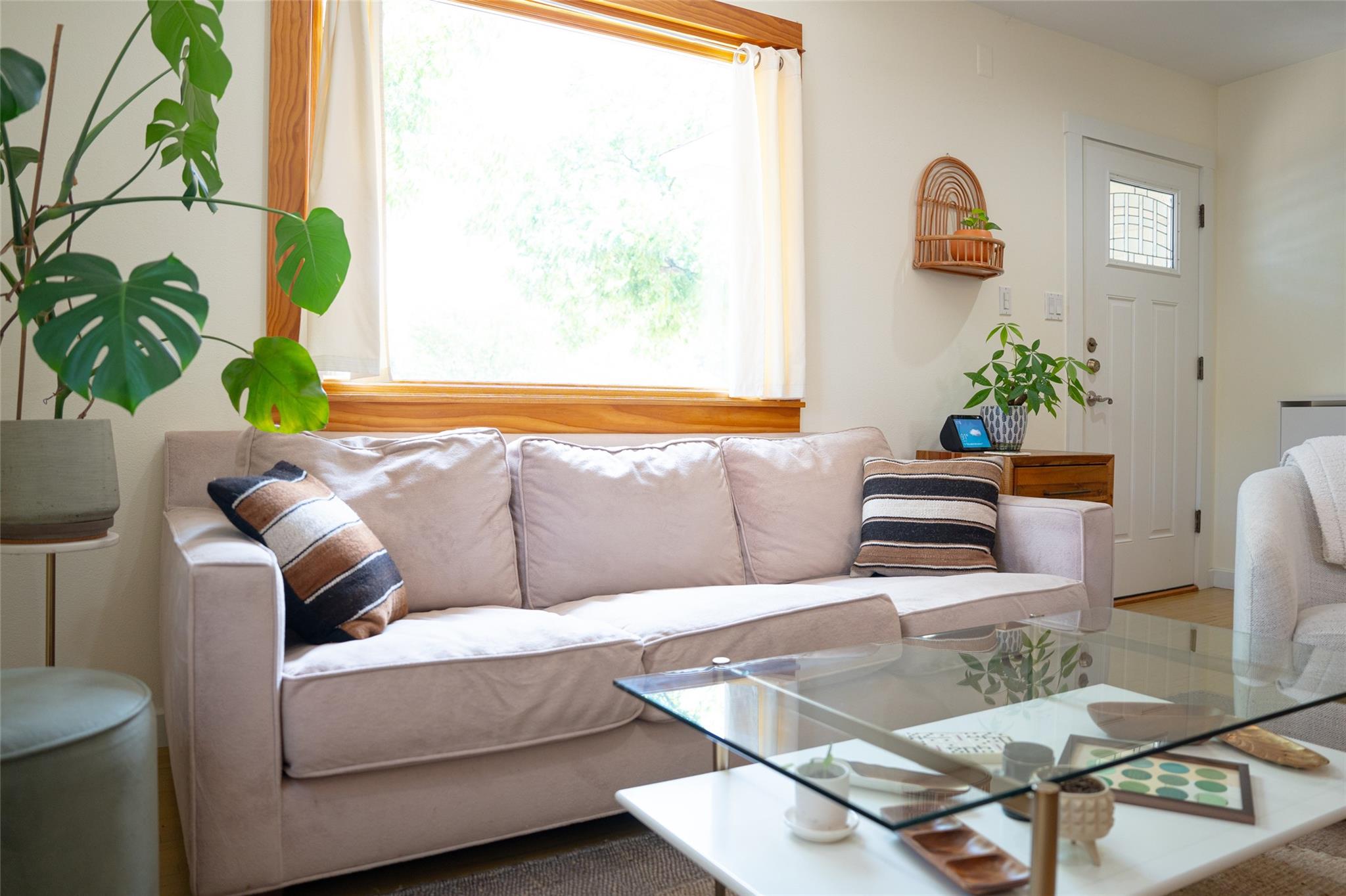 Natural wood casing frames a large window, fillin
