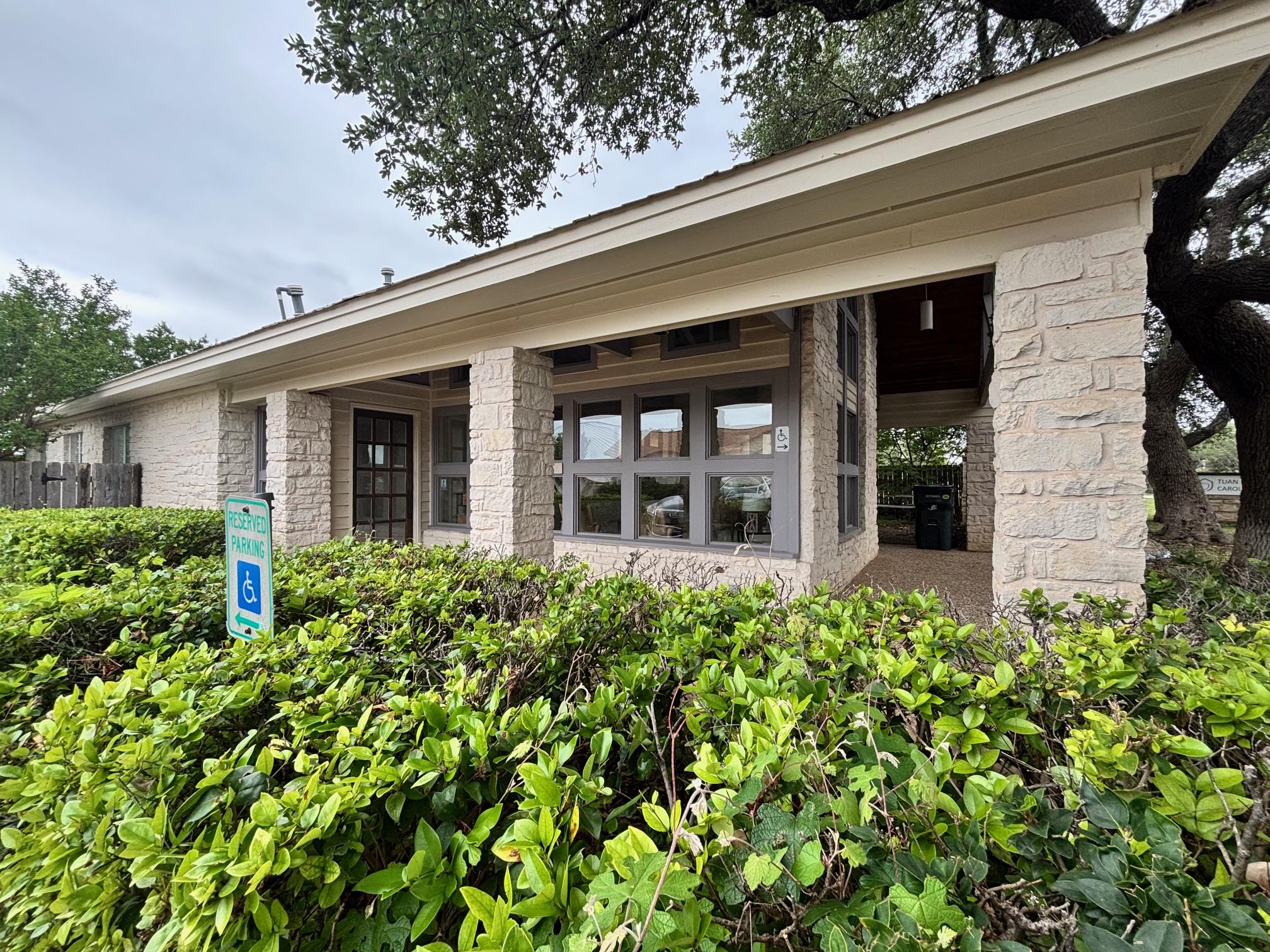 Sturdy stone columns support the covered entryway