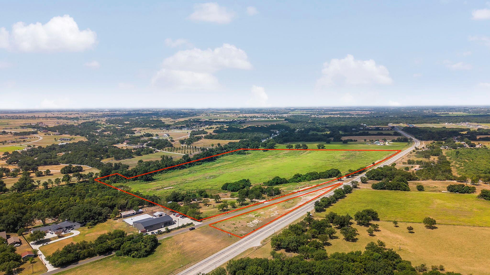 An expansive parcel of level land surrounded by m