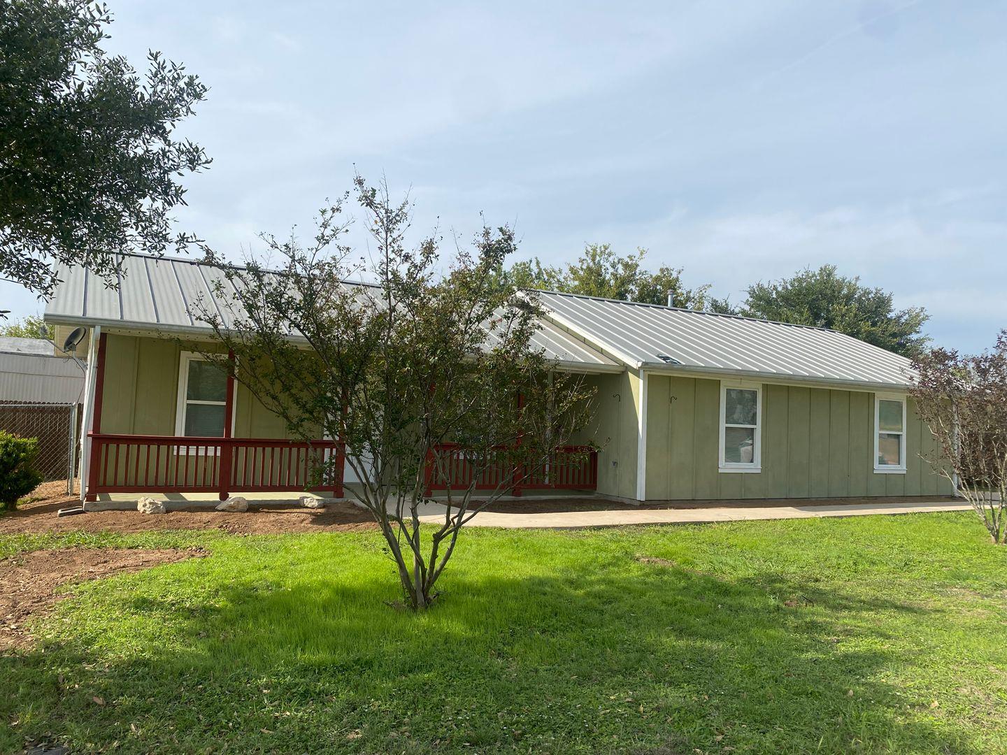 A durable metal roof tops this classic single-sto