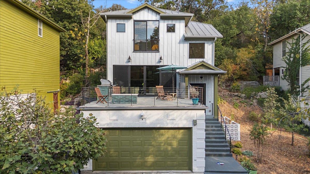 Clean lines and a spacious elevated patio define 