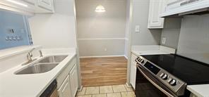 An efficient kitchen layout opens directly to an 