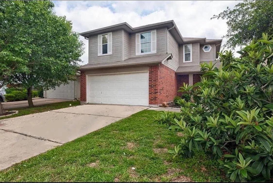 Classic brick and siding accents define the exter