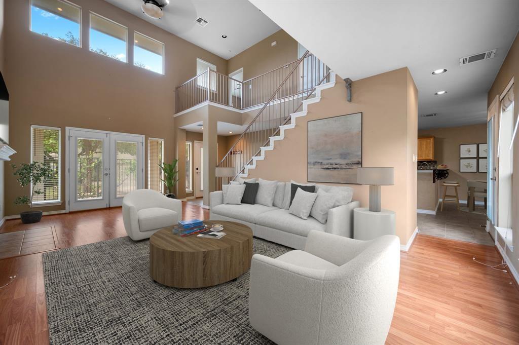 Double-height ceilings and a sweeping staircase a