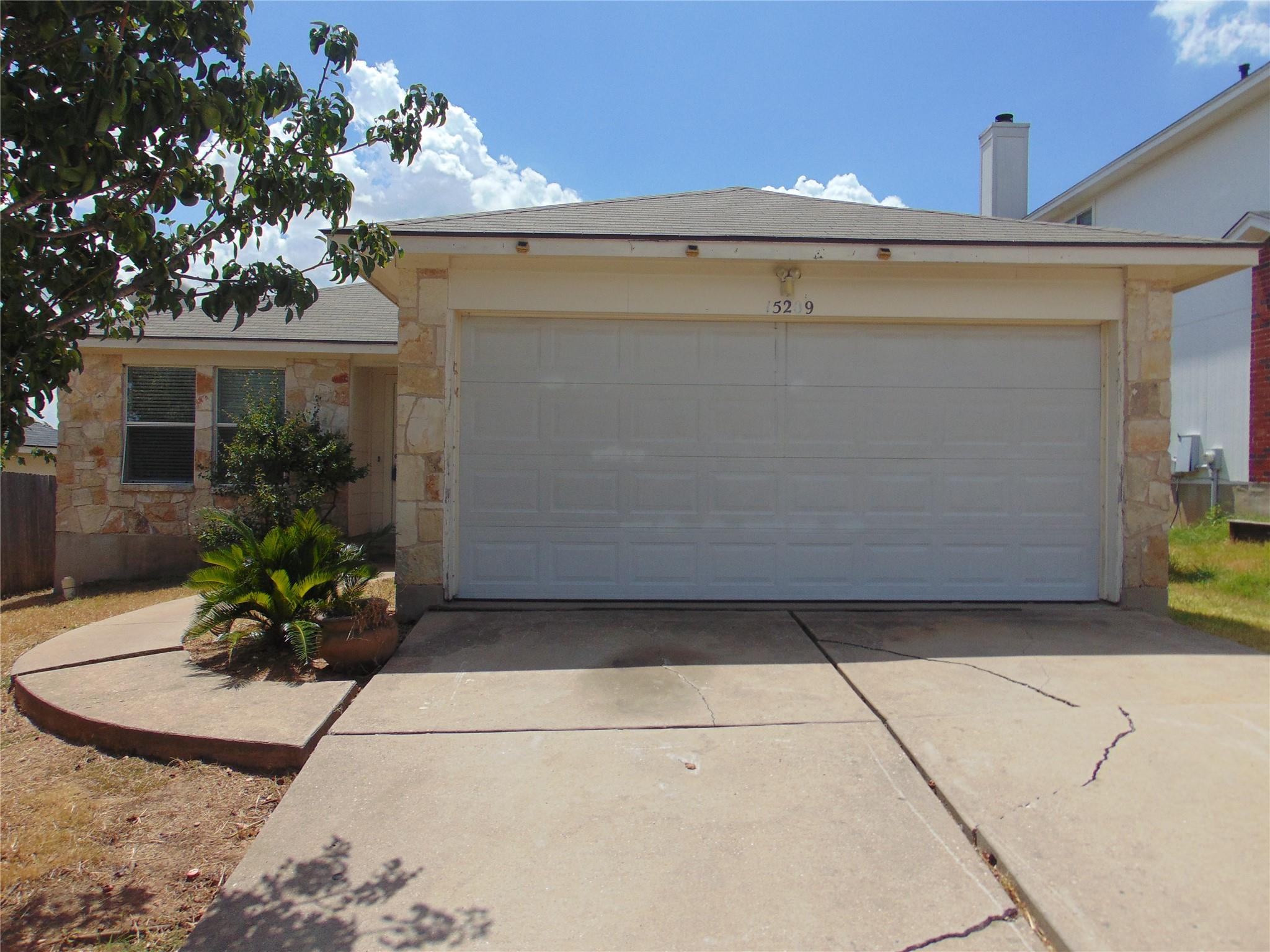 Natural stone accents highlight the exterior of t