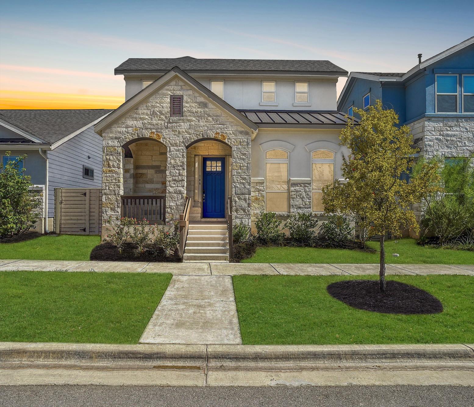 Textured stone veneer accents the facade of this 