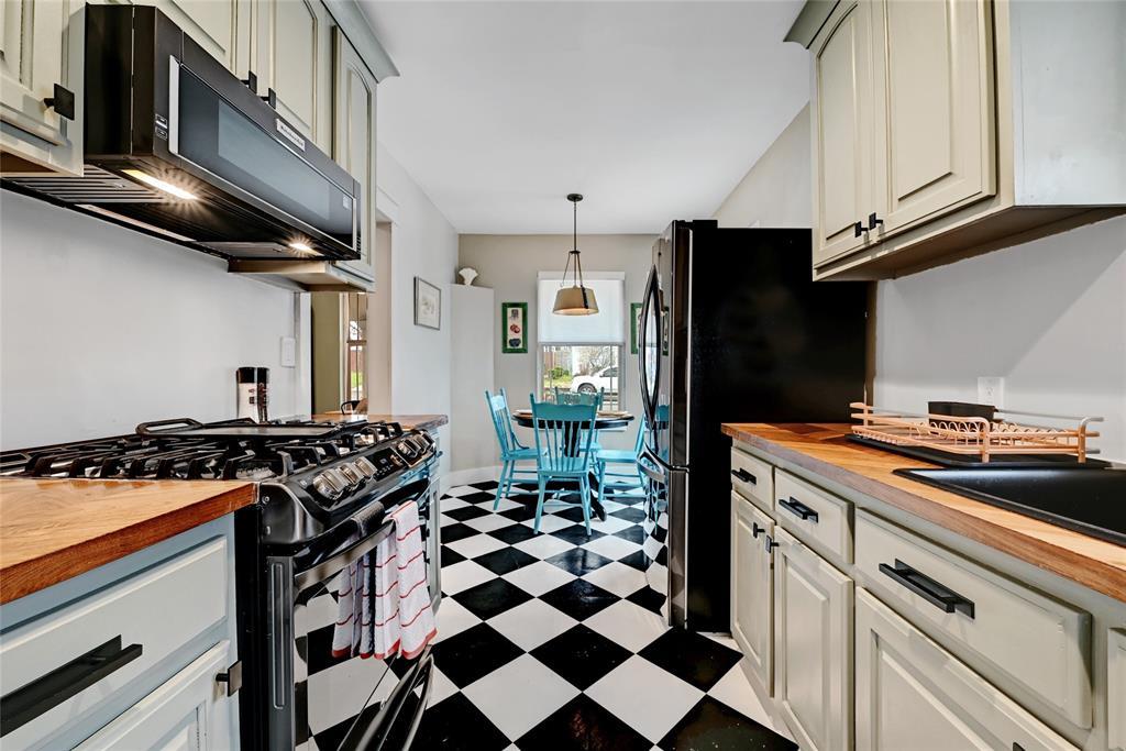 Striking checkerboard flooring grounds this updat