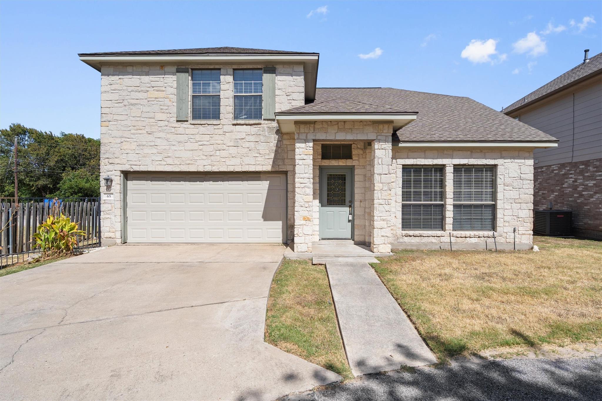 Textured light stone masonry defines this multi-l
