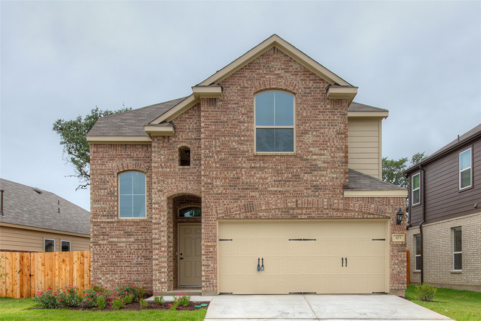 Classic brick craftsmanship defines this two-stor