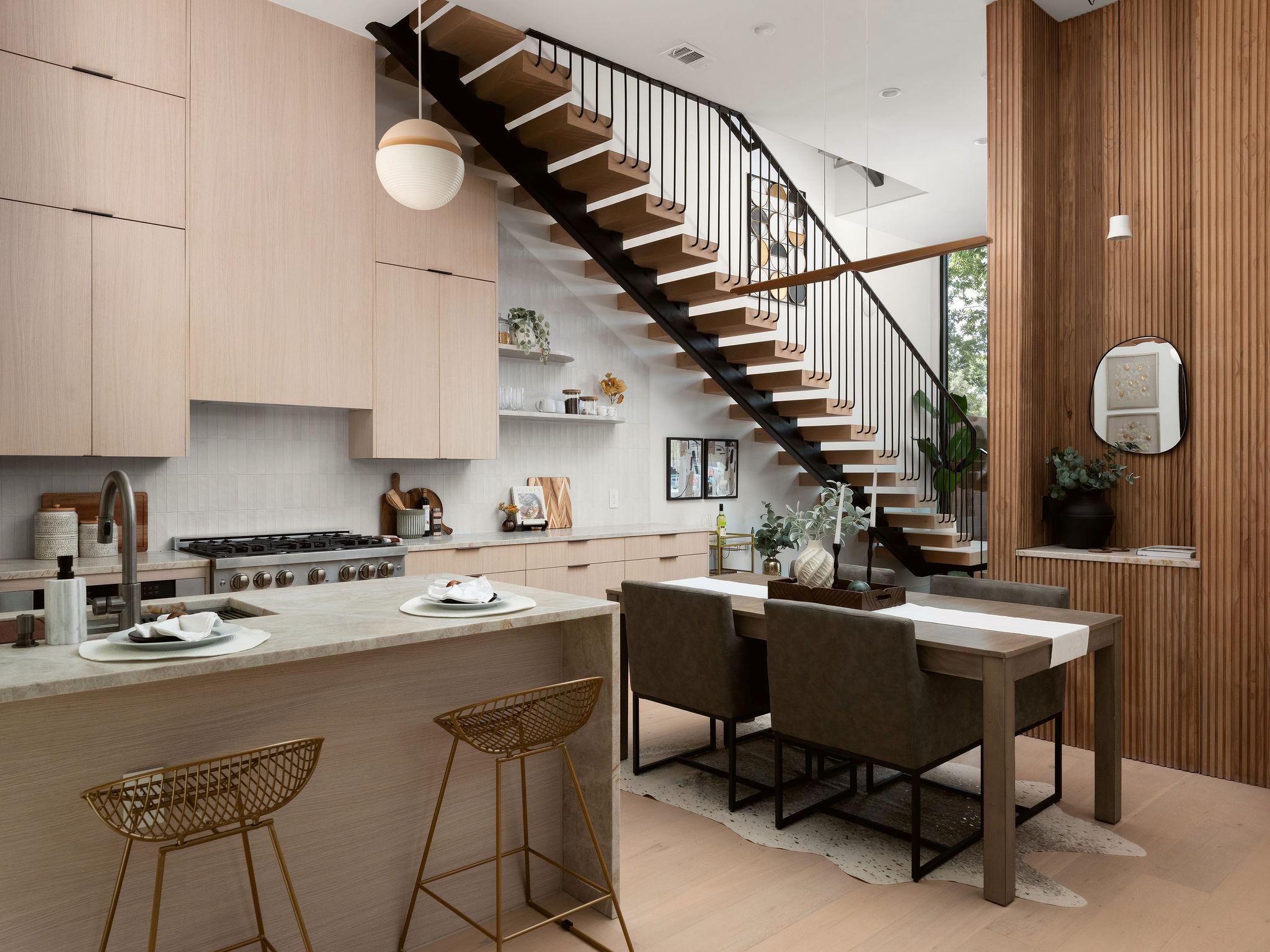 Custom cabinetry and an architectural staircase d