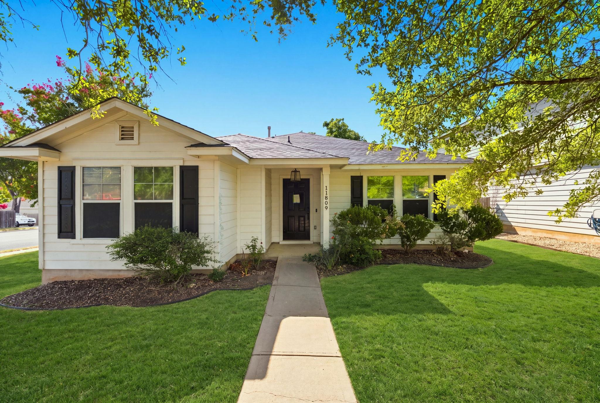 A straight concrete pathway leads directly to the