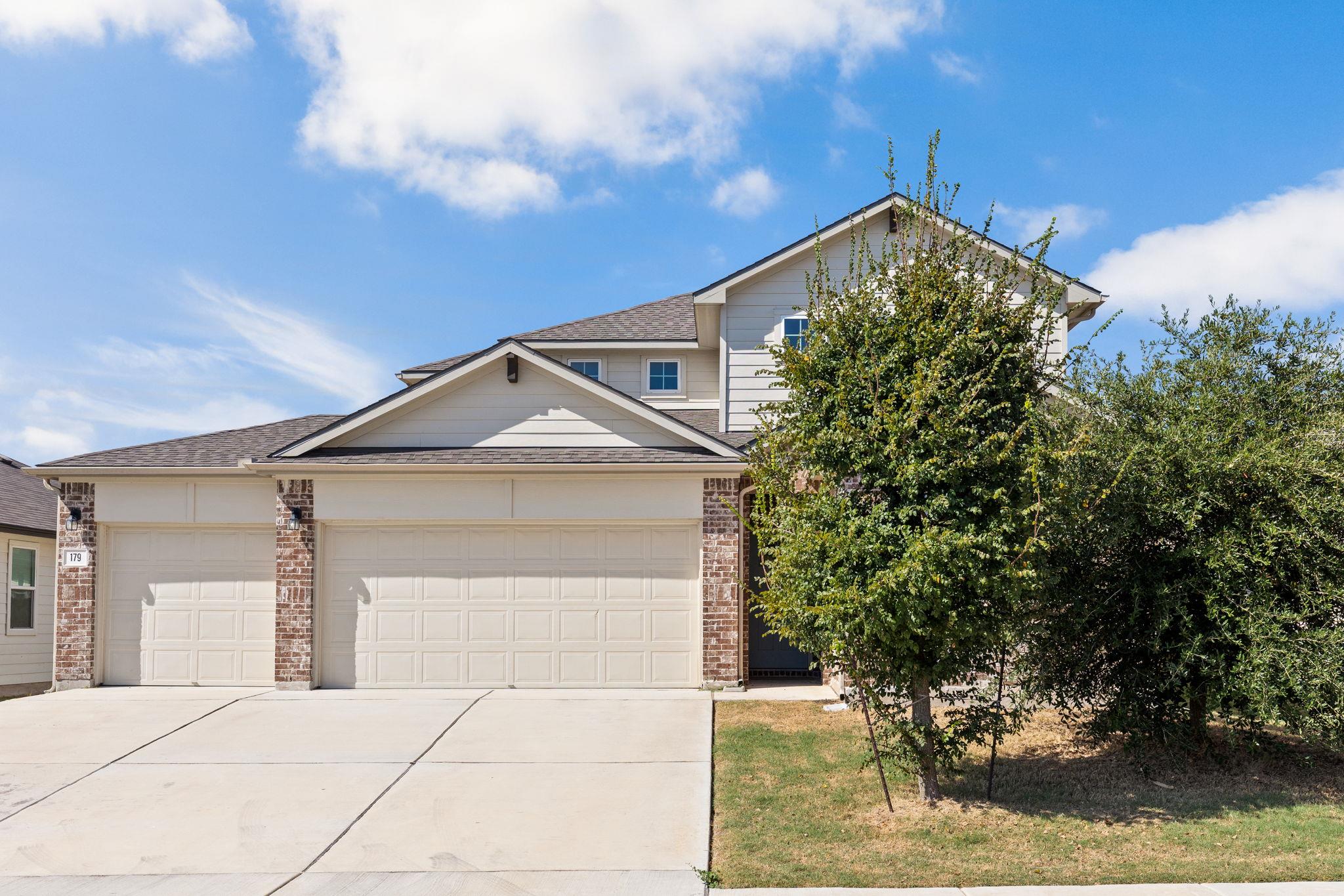 Multi-level gables and brick accents define the c