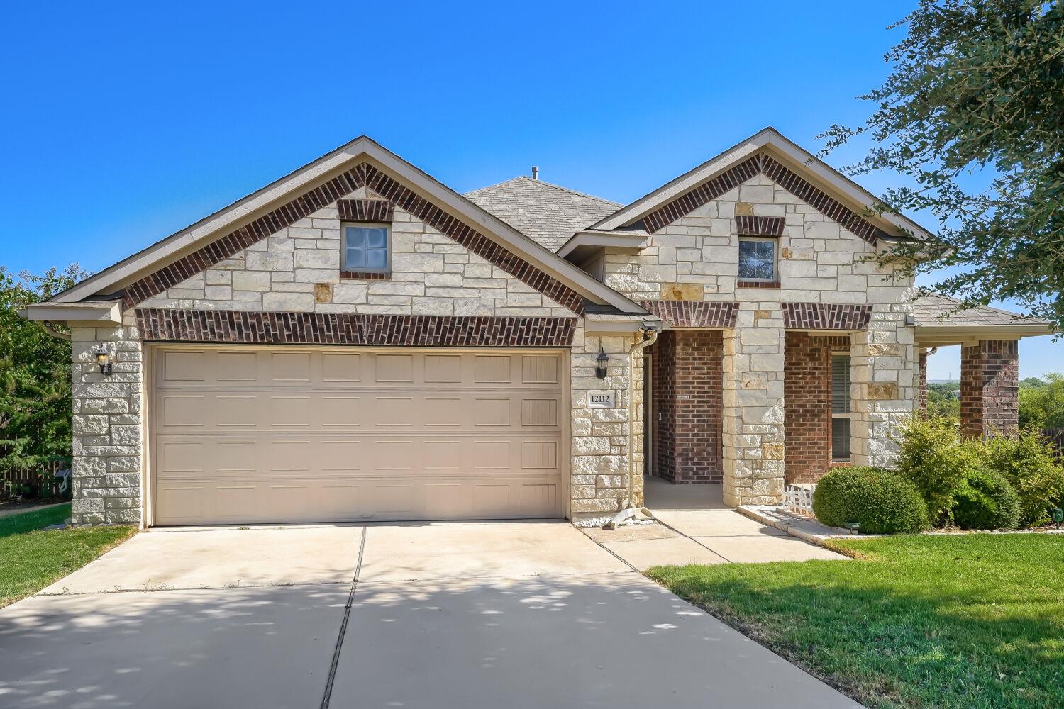 Limestone and brick accents frame the exterior of