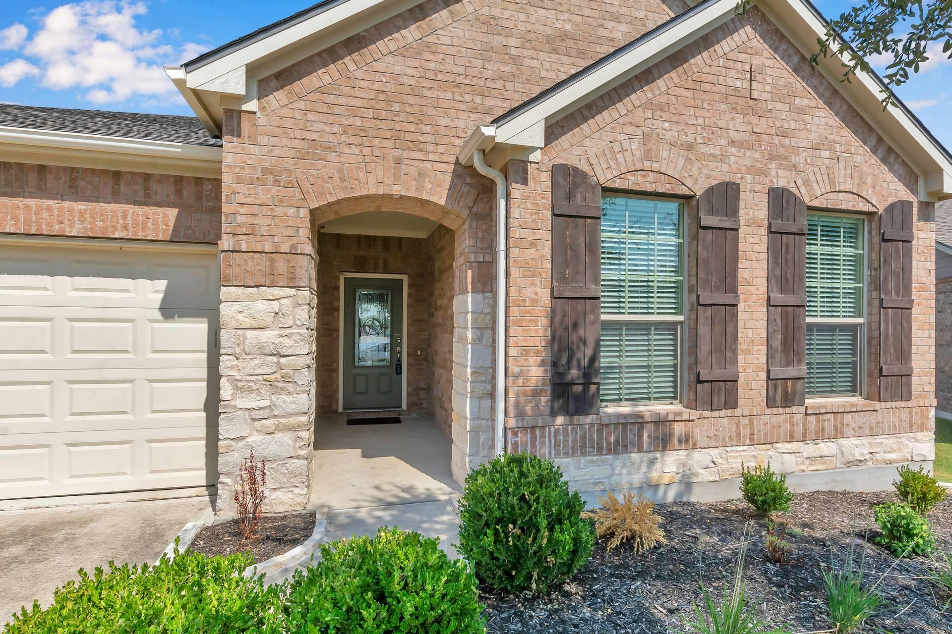 Rich brick and stone masonry shapes a welcoming f