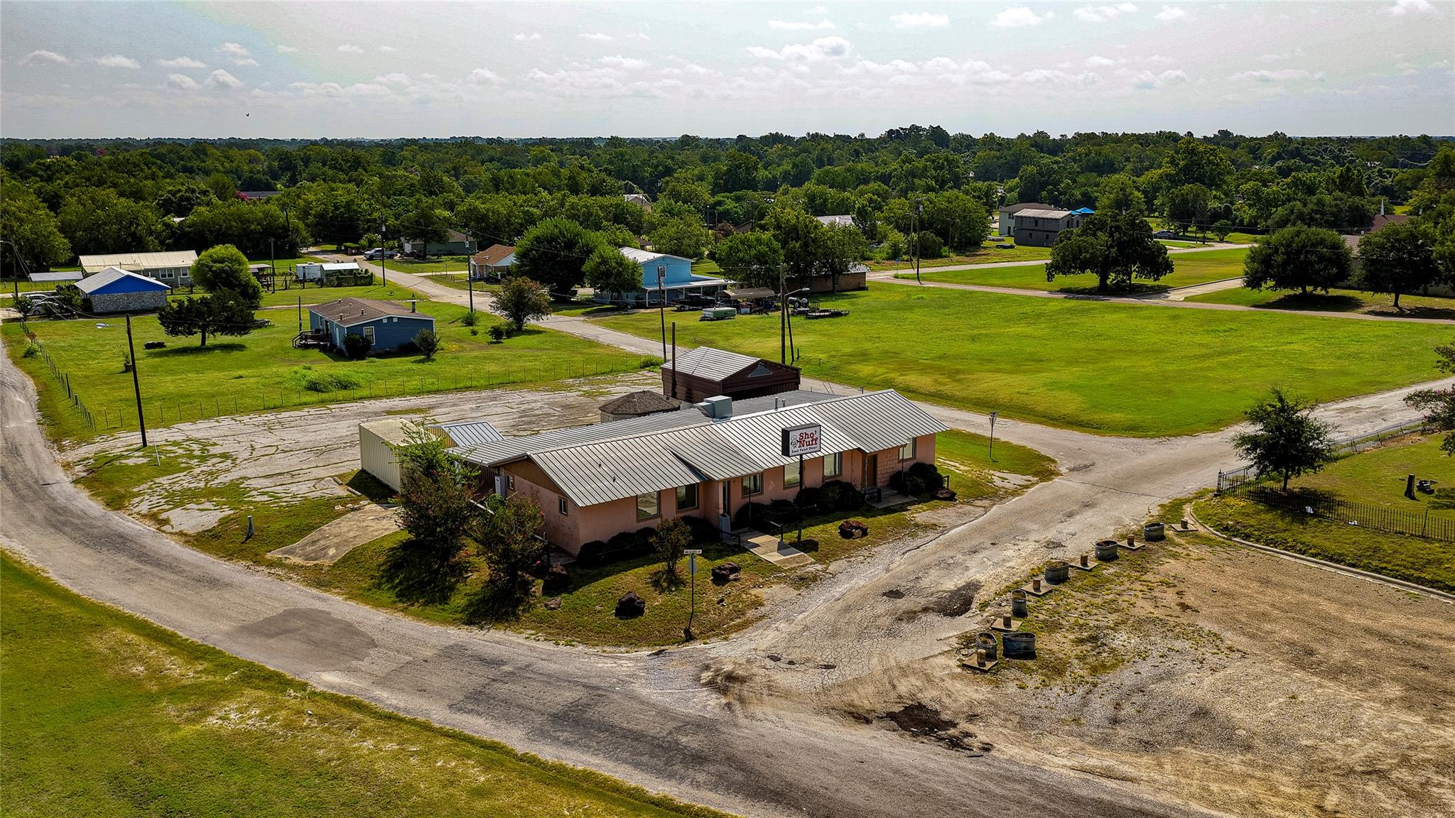Aerial view reveals a metal-roofed structure nest