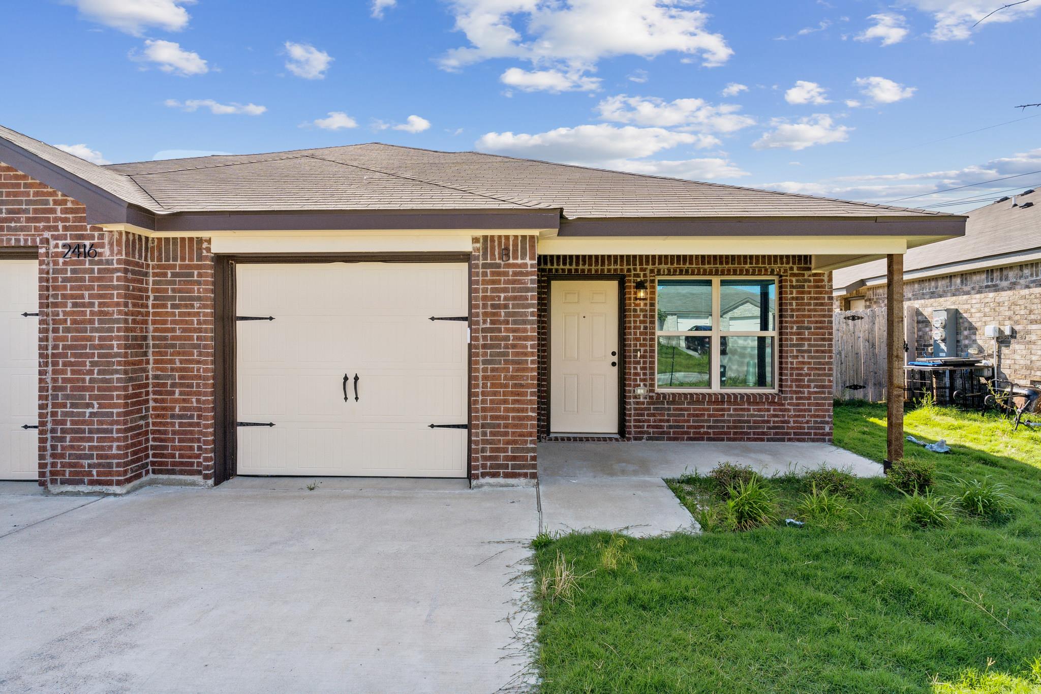 Classic brick craftsmanship frames the welcoming 