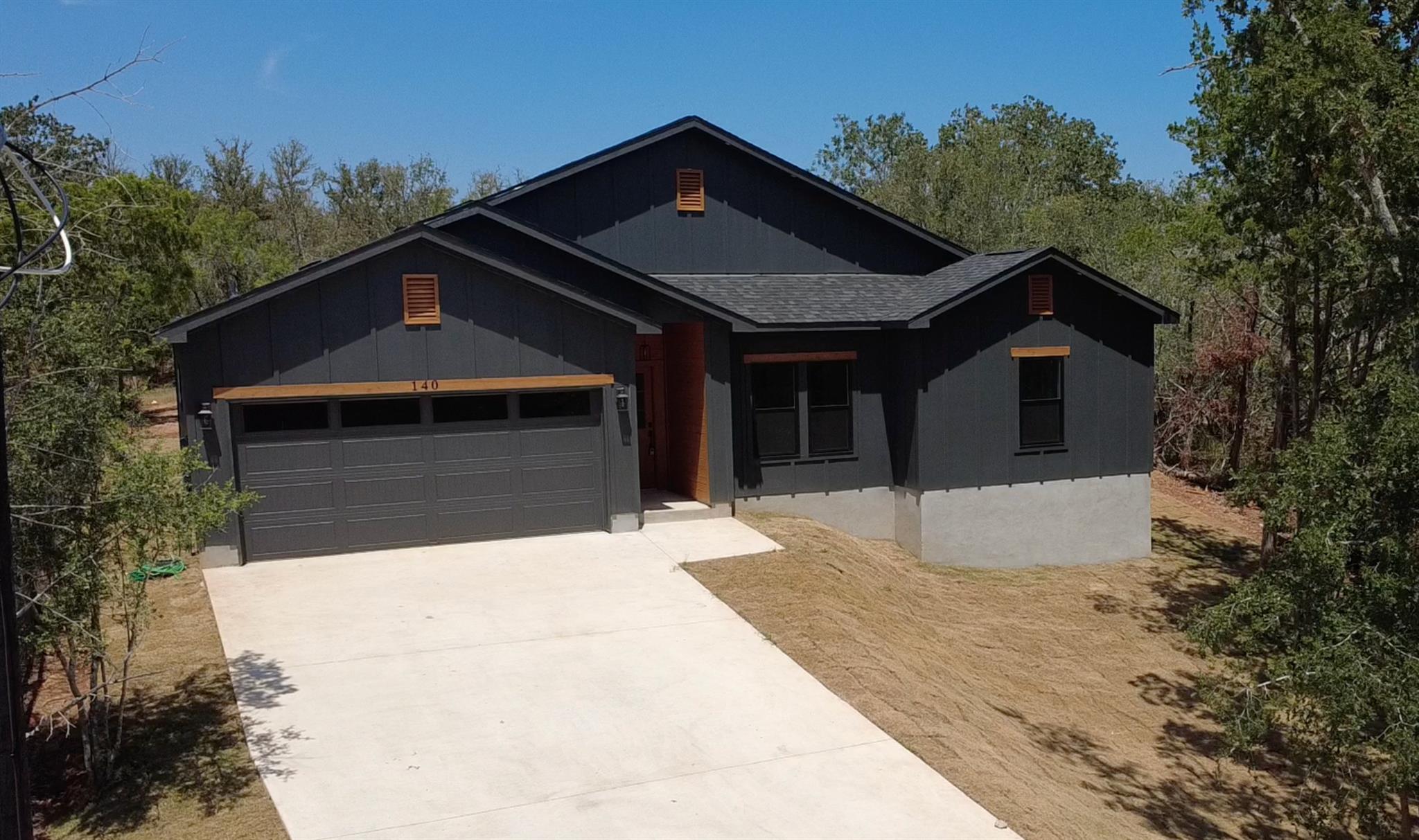Dark vertical siding contrasts beautifully with w