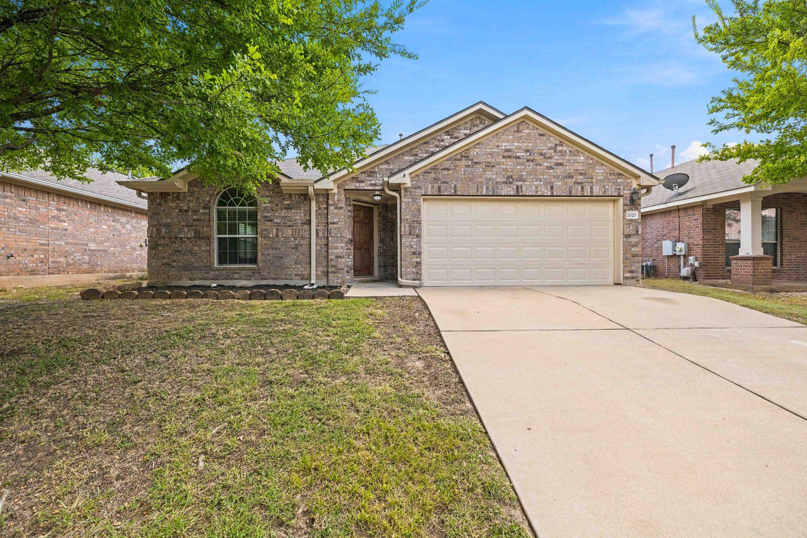 Classic brick exterior showcases an arched front 