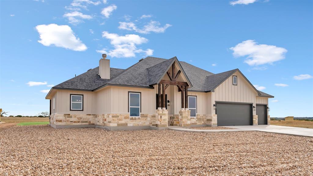 Natural stone accents and bold timber gables defi
