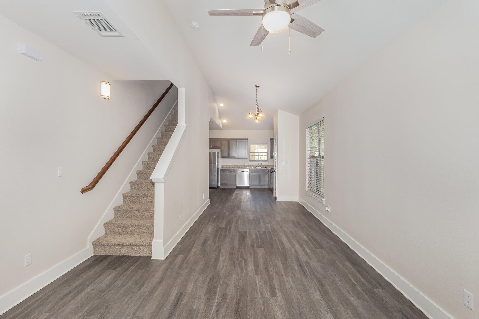 Smooth walls and neutral flooring establish a cle